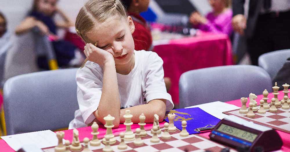 A scholastic chess player